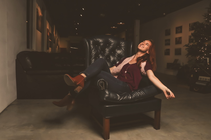 armchair, full length, indoors, young women, furniture, lifestyle, leather boots, wear, adult, face, relaxation, beautiful woman, sit, office, scarf, sofa