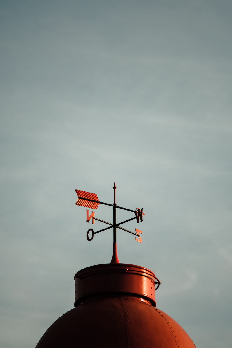 low angle view, high section, directional, roof tile, pointing, sign, cloud - sky, meteorology, roof, daytime, guidance, building, aircraft, rotterdam