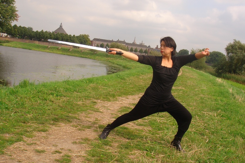 exercise, day, young adult, human arm, black, swordplay, real people, shaolin kung fu, land, standing, game, leisure activity, sword, lake, holding, nature