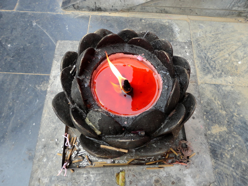 china, glowing, asia, heat - temperature, outdoors, red, candle, close-up, burning, high angle view, footpath, day, henan, metal, lotus flower, no people