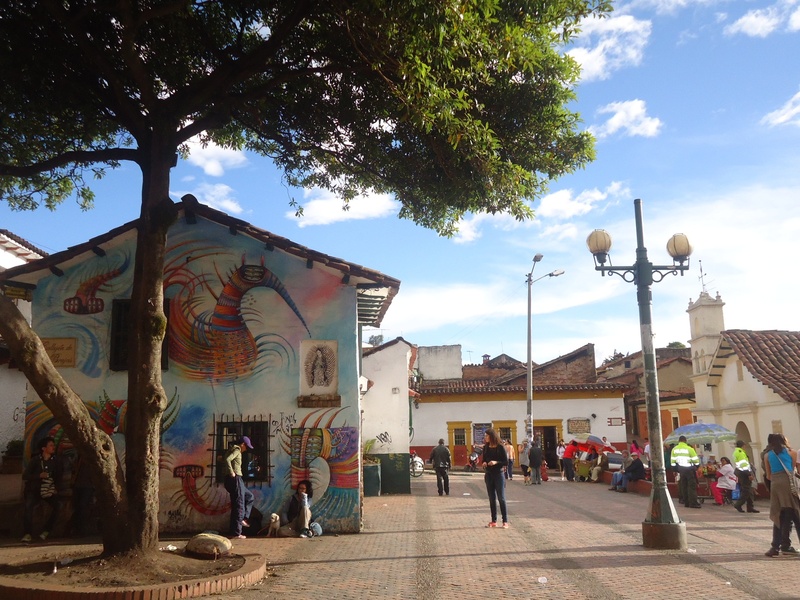 real people, street, tree, bogota, sunlight, city, built structure, 2K, quevedo jet, art and craft, men, street light, day, building, graffiti, plant