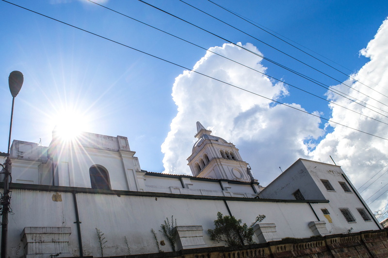 outdoors, spire, iglesia, bogota, city, architecture, weather, flare, day, building exterior, cable, low angle view, tower, built structure, lens flare