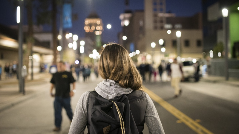 adult, transportation, fresno, warm clothing, building exterior, women, hairstyle, incidental people, one person, clothing, city, architecture, street