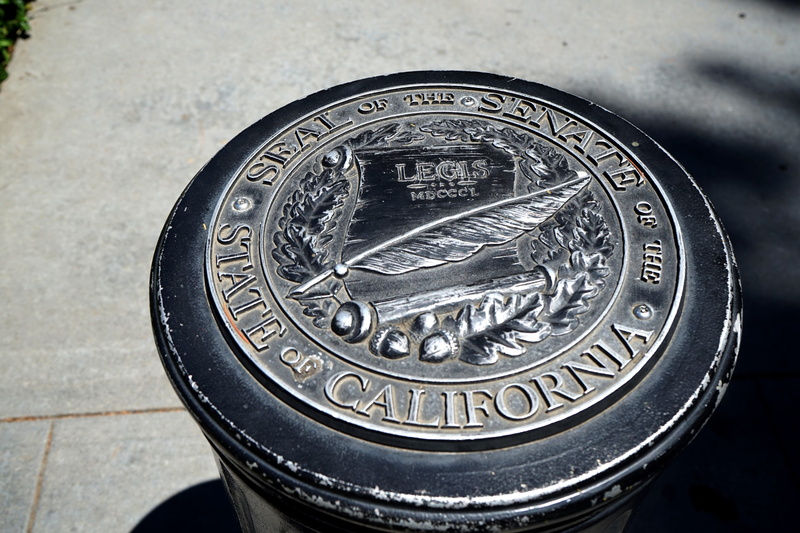 metal, coin, united states, seal of the senate of the state of california, number, geometric shape, city, finance, high angle view, communication, california