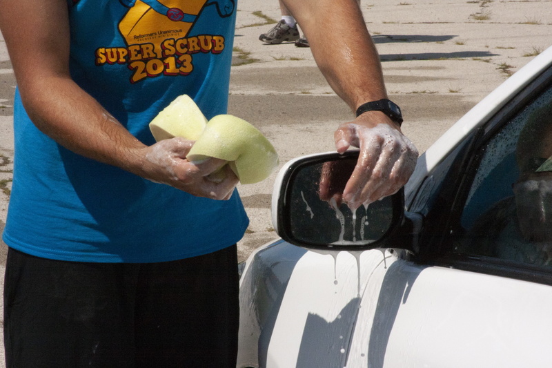 mode of transportation, sport, human hand, standing, lifestyles, front view, sports equipment, fundraiser, people, rockford, super scrub, day, ball, outdoors