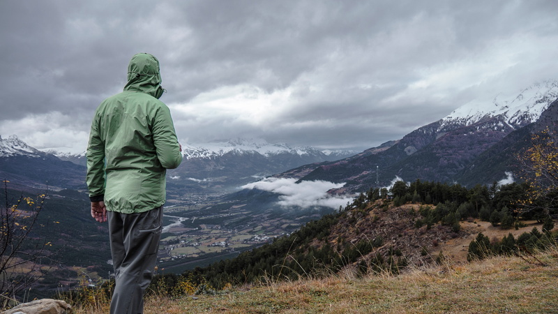 field, adventure, landscape, beauty in nature, looking at view, jacket, clouds, scenics - nature, one person, cold temperature, wearing, 4K, town, cloudy