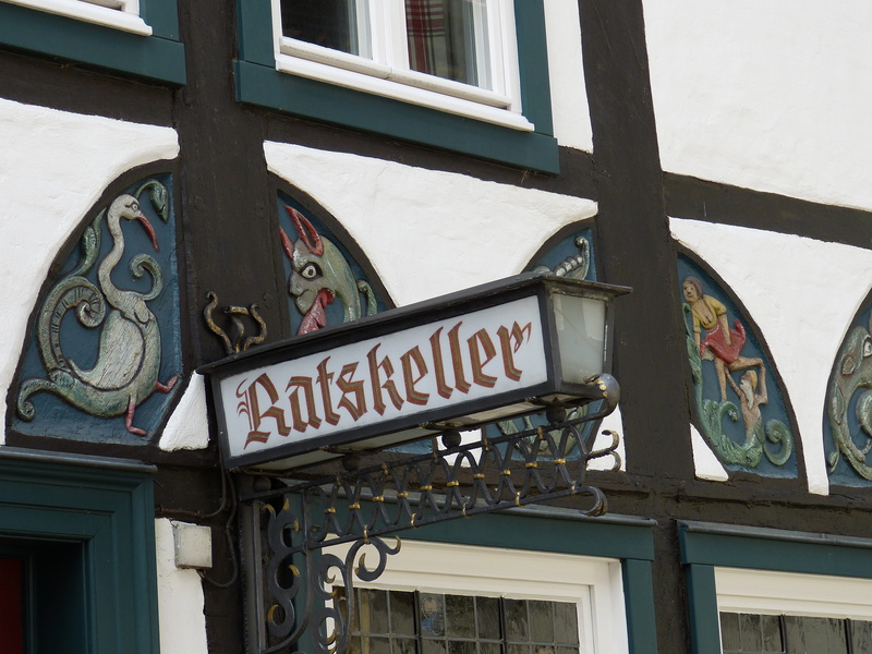 city, shield, built structure, ratskeller, building exterior, ornate, western script, outdoors, arts culture and entertainment, old, architecture, rheda-wiedenbrück