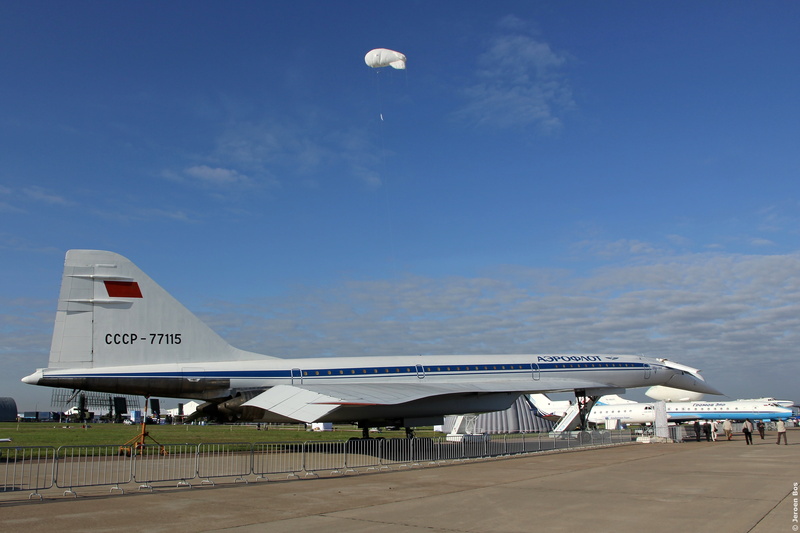 transportation, blue, supersonic, the plane, airport, cloud - sky, communication, cccp, outdoors, mode of transportation, gray, airport runway, architecture