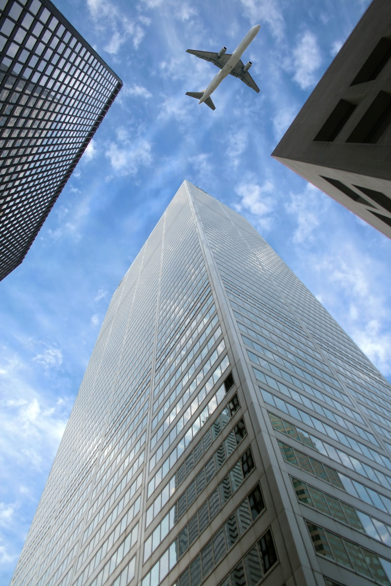 air vehicle, street, building exterior, high-rise, directly below, flying, highrise, airport, cloud - sky, top, above, afternoon, office, tall - high, urban