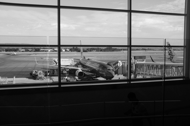 waiting, window, airport terminal, sky, cloud - sky, transparent, airplane, airport runway, mode of transportation, airport, architecture, no people, black-and-white