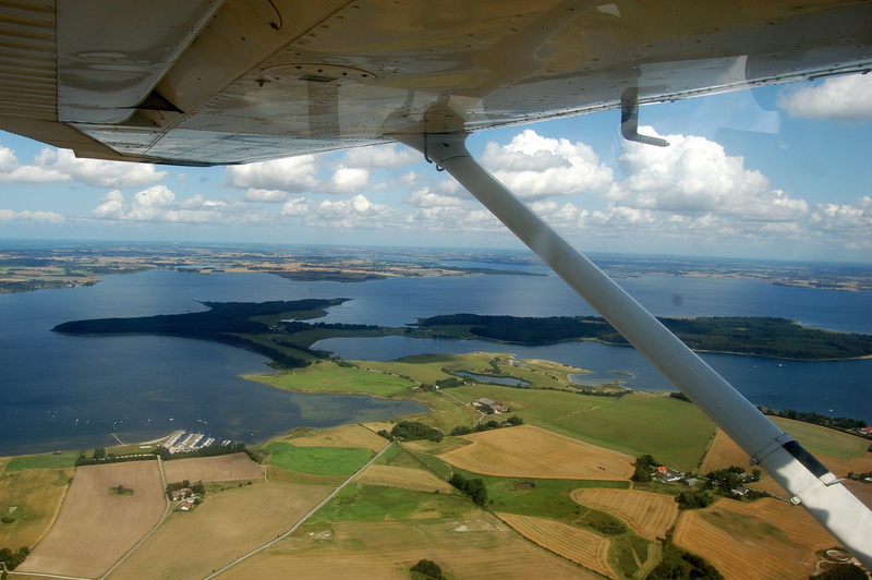 aerial view, water, air vehicle, cloud - sky, view, cessna, land, mode of transportation, flight, flying, nature, outdoors, transportation, aircraft wing