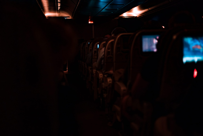 travel, in a row, hue, large group of people, airplane, train, seat, passenger, real people, orange, vehicle seat, lighting equipment, somewhere above new south wales