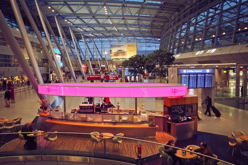 ceiling, food and drink, large group of people, aviation, restaurant, glass, men, arrival, terminal, window, city, international, luggage, human, düsseldorf