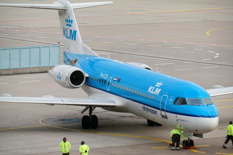 blue, two people, men, machine, road, landed, air vehicle, day, commercial airplane, travel, passenger aircraft, klm, people, reflective clothing, arrival