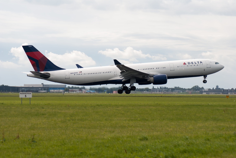 no people, sky, schiphol, mode of transportation, white, air vehicle, outdoors, grass, transportation, motion, airport, countries, airplane, airport runway