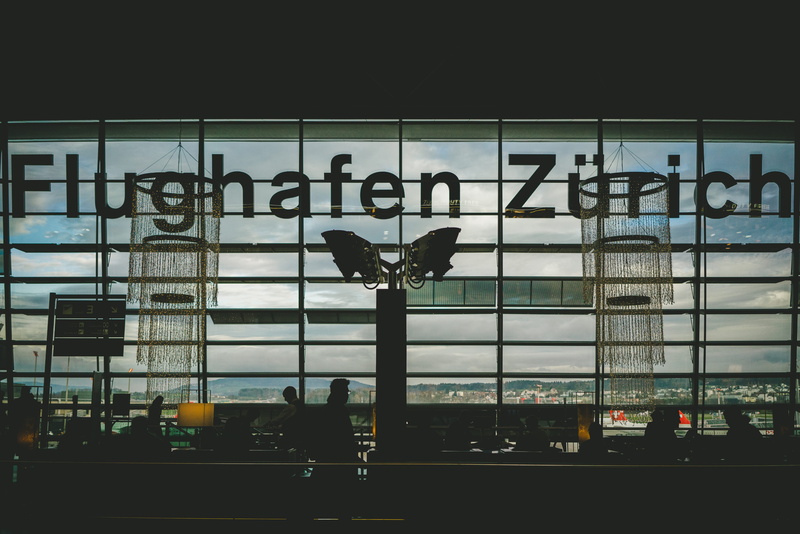 animal representation, terminal, animal, window, convention center, monitor, outdoors, building, human, art and craft, people, flughafen, metropolis, electronics