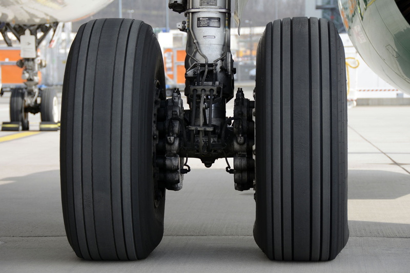 air vehicle, rubber, airplane, 1080P, roll, outdoors, industry, main landing gear, motor vehicle, machinery, land Vehicle, no people, wheel, travel, technology
