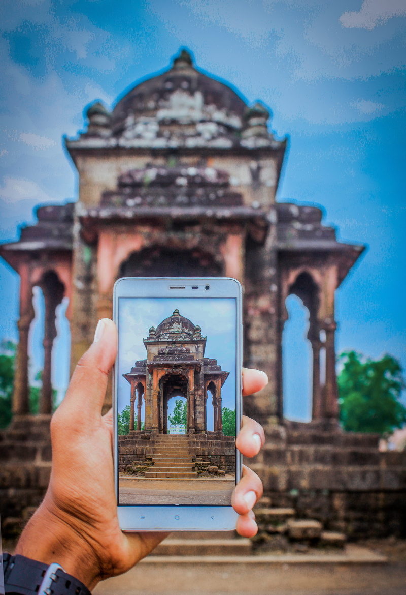 hand, india, building exterior, wilson hills (hill station), religion, built structure, focus on foreground, architecture, holding, history, finger, one person