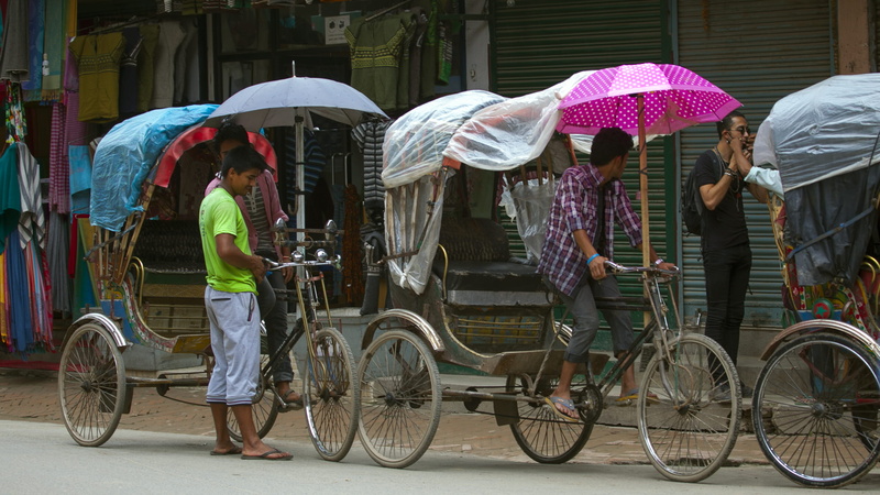 city life, adult, mode of transportation, women, bicycle, group of people, city, rain, kathmandu, men, people, transportation, rainy season, nepal, street