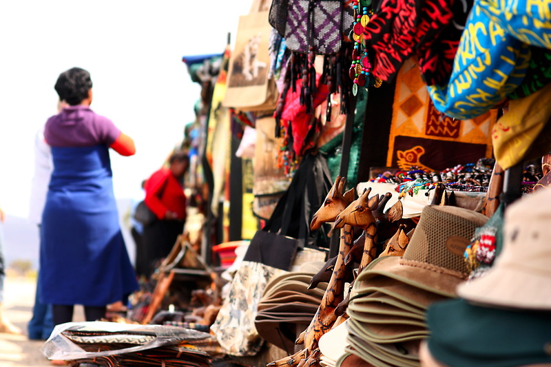 men, shopping, fashion, variation, buying, clothing, day, retail display, travel, small business, road, market, stall, giraffes, consumerism, group of people