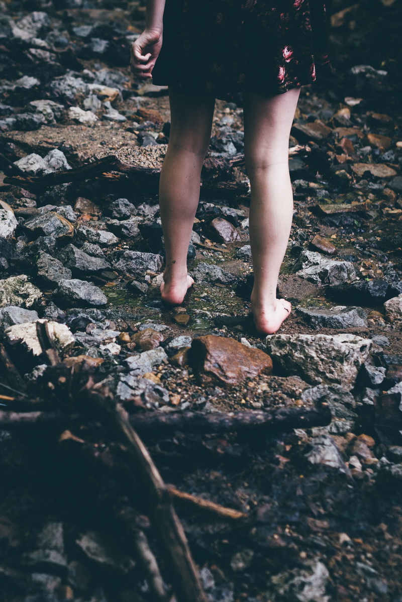 bare feet, one person, rocks, nature, lifestyles, selective focus, leisure activity, real people, summer, dress, surface, ocean, legs, black, human foot
