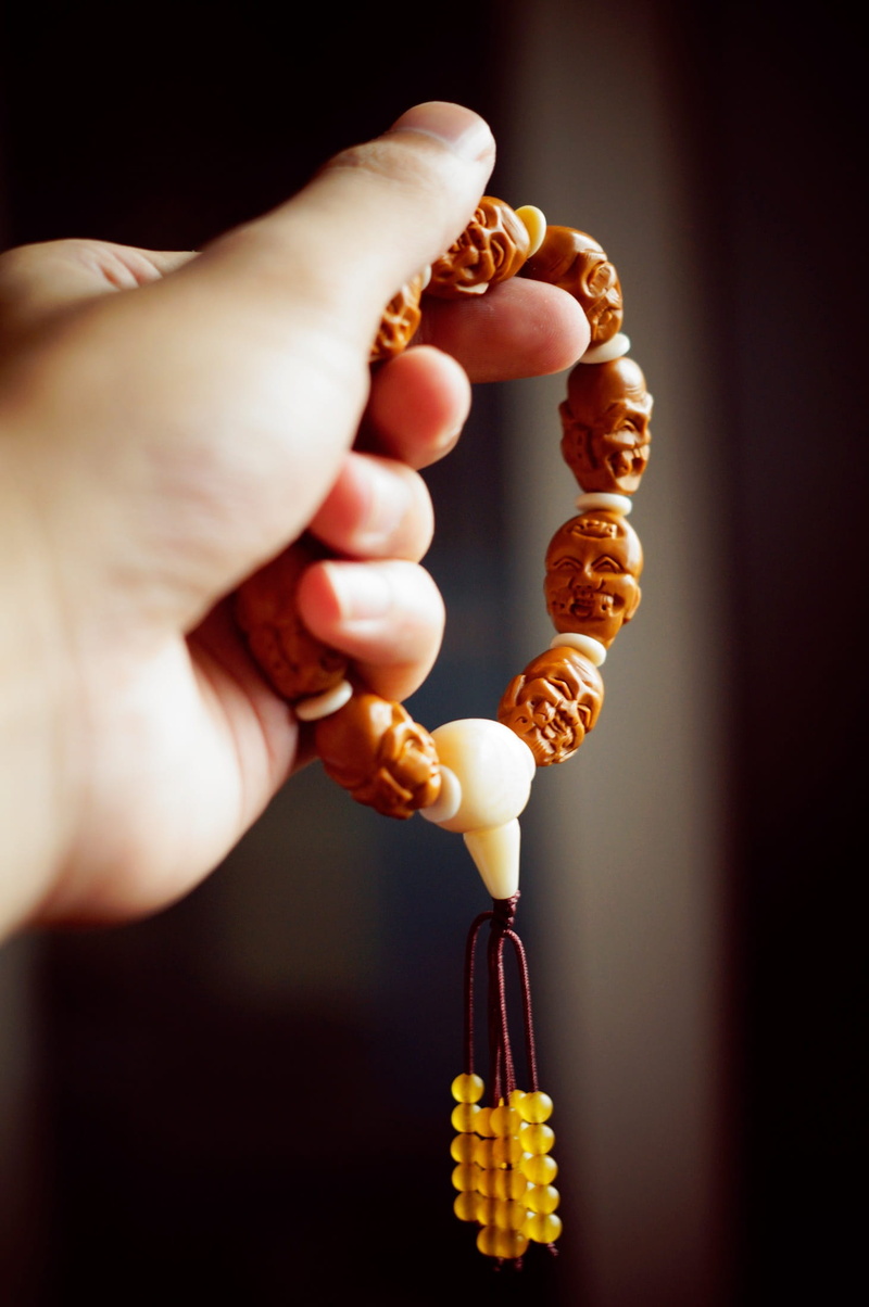 hand, Zen, Buddha, food and drink, human finger, adult, belief, enlightenment, beads, human body part, holding, indoors, prayer, unrecognizable person