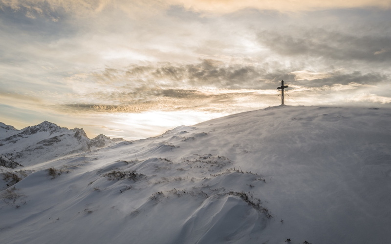 beauty in nature, sky, landscape, cold temperature, tranquility, leisure activity, snowcapped mountain, human arm, outdoors, cross, scenics - nature, non-urban scene