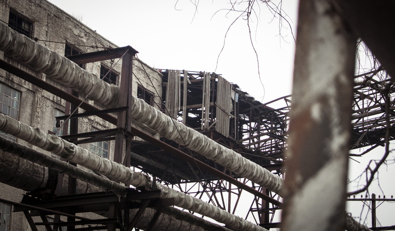 transportation, built structure, nature, factory, bare tree, metal, old, tree, windows, bridge, low angle view, clear sky, no people, focus on background