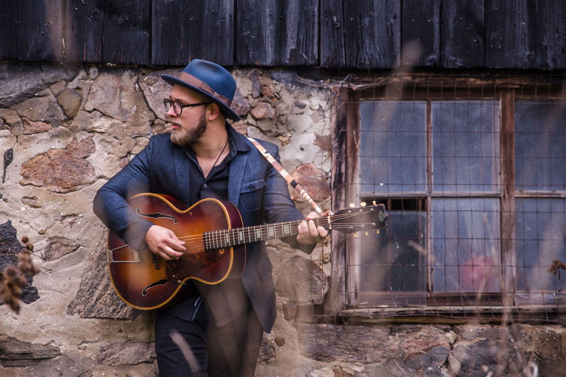 facial hair, men, young men, skill, contemplation, eyeglasses, portrait, acoustic guitar, adult, artist, guitar, musical instrument, plucking an instrument