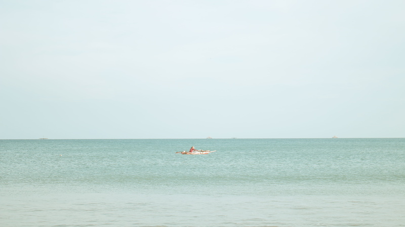 leisure activities, sea, fisherman, outdoors, horizon over water, waves, tranquility, real people, beauty in nature, vehicle, one person, jet ski, watercraft