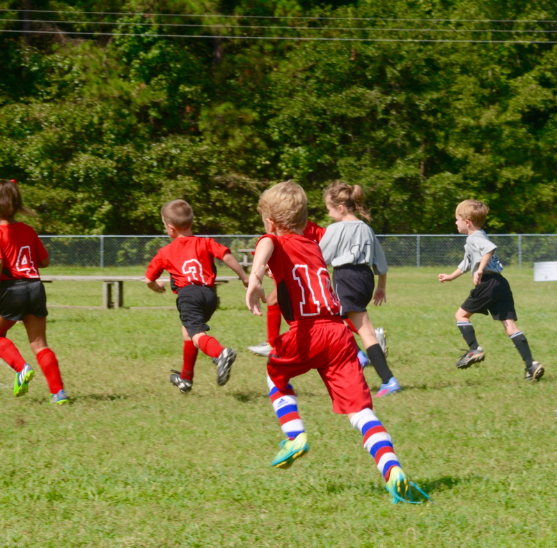 teamwork, competition, grass, running, pre-adolescent child, childhood, people, athlete, sports Uniform, grandson, day, sports, boys, team sport, playing Field