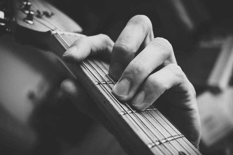 clef, finger, human body part, musical instrument string, string instrument, detail, tilt, practise, skill, person, standard, male, bass guitar, wood, black and white
