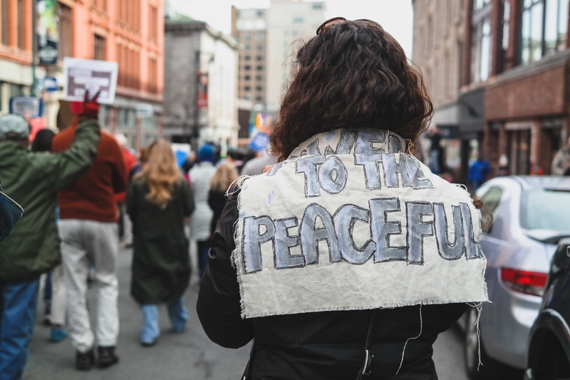 back, day, curlyhair, focus on foreground, united states, protester, portland, woman, city, protest, real people, protestor, city life, peaceful, crowd