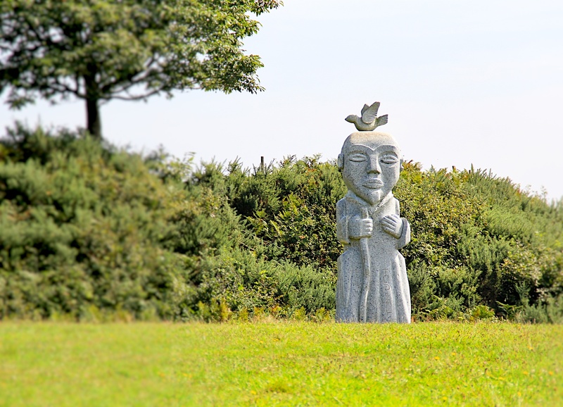 statue, day, art and craft, holy, grass, no people, field, holy spirit, clear sky, nature, land, faith, human representation, craft, green color, tree