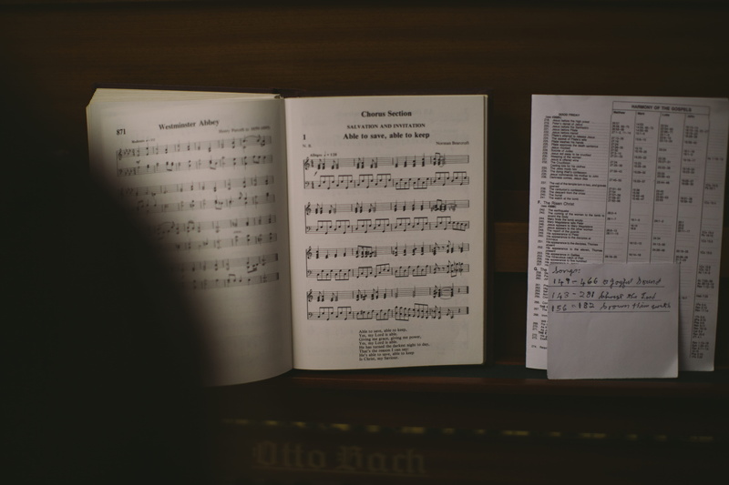 paper, indoors, still life, table, text, music, piano key, communication, sheet, sheet music, western script, piano, 5K, open, no people, book, page, hand