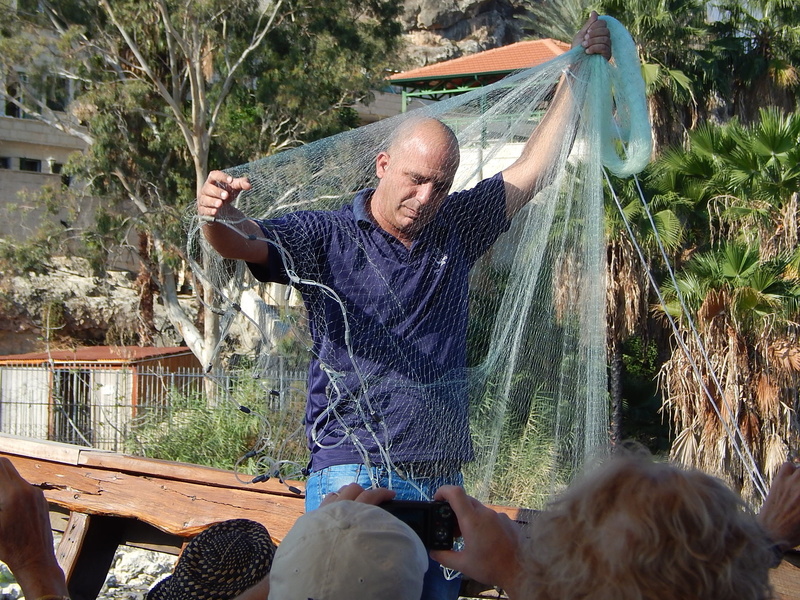 water, three quarter length, catch, young adult, fishing, human arm, smiling, net, outdoors, lifestyles, one person, emotion, casting, young men, cast