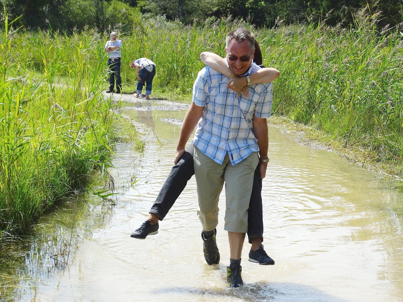 nature, outdoors, group of people, walking, leisure activity, self help, water, man, flood, standing, piggyback, casual clothing, 2K, real people, young men