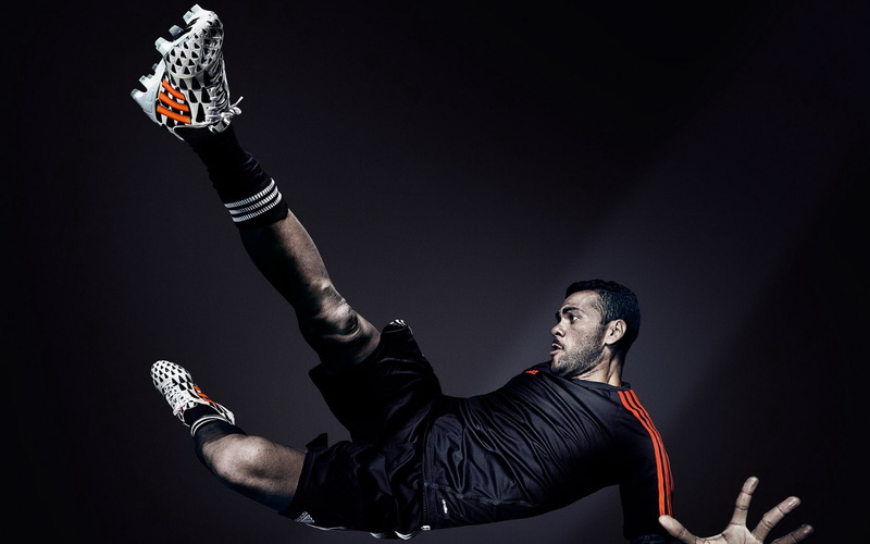 activity, brand, sport, one person, bad habit, social issues, adult, studio shot, black color, real people, adidas, arms raised, world, excitement, looking