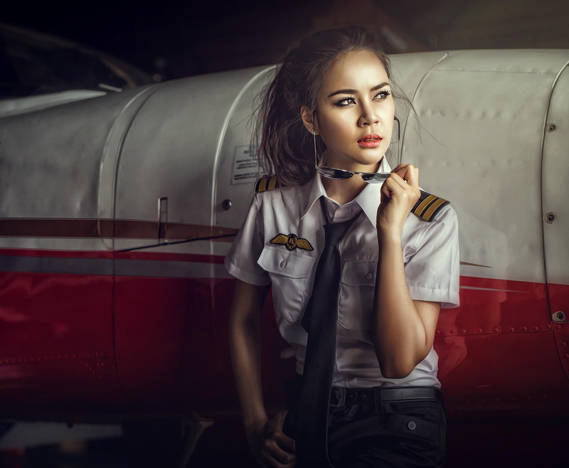cigarette, looking at camera, mode of transportation, young women, bad habit, smoking issues, front view, holding, beautiful woman, hairstyle, young adult