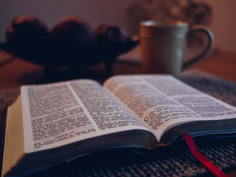 education, paper, beside, text, drink, white, the media, bible, grey, photography, table, religion, reading, people, activity, still life, mat, newspaper