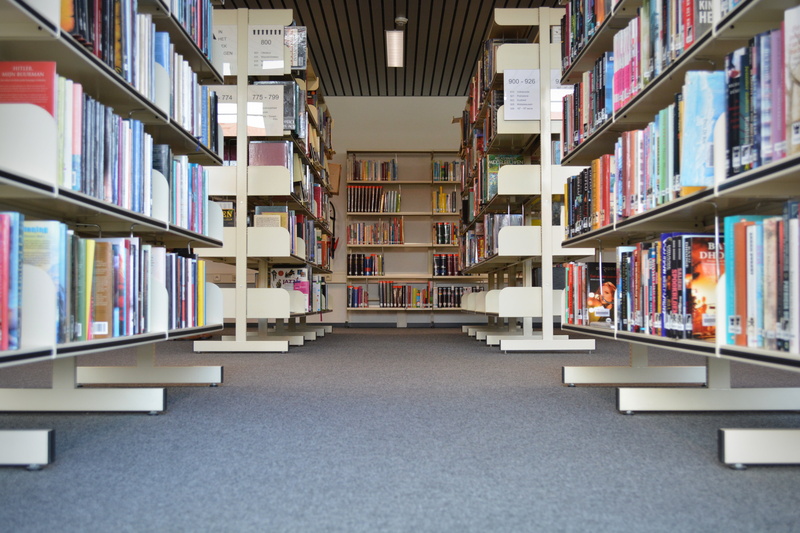 library, aisle, studying, symmetry, learning, indoors, read, in a row, 5K, bookmarks, education, textbook, abundance, shelf, choice, large group of objects