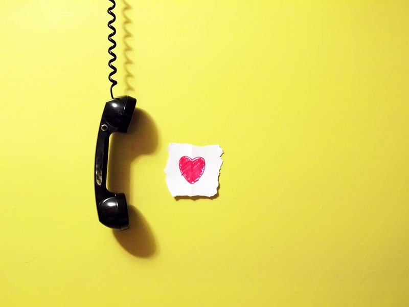 yellow background, 1080P, phone cord, telephone, yellow, still life, wall, emotion, handset, paper, high angle view, hanging, black, studio shot, indoors
