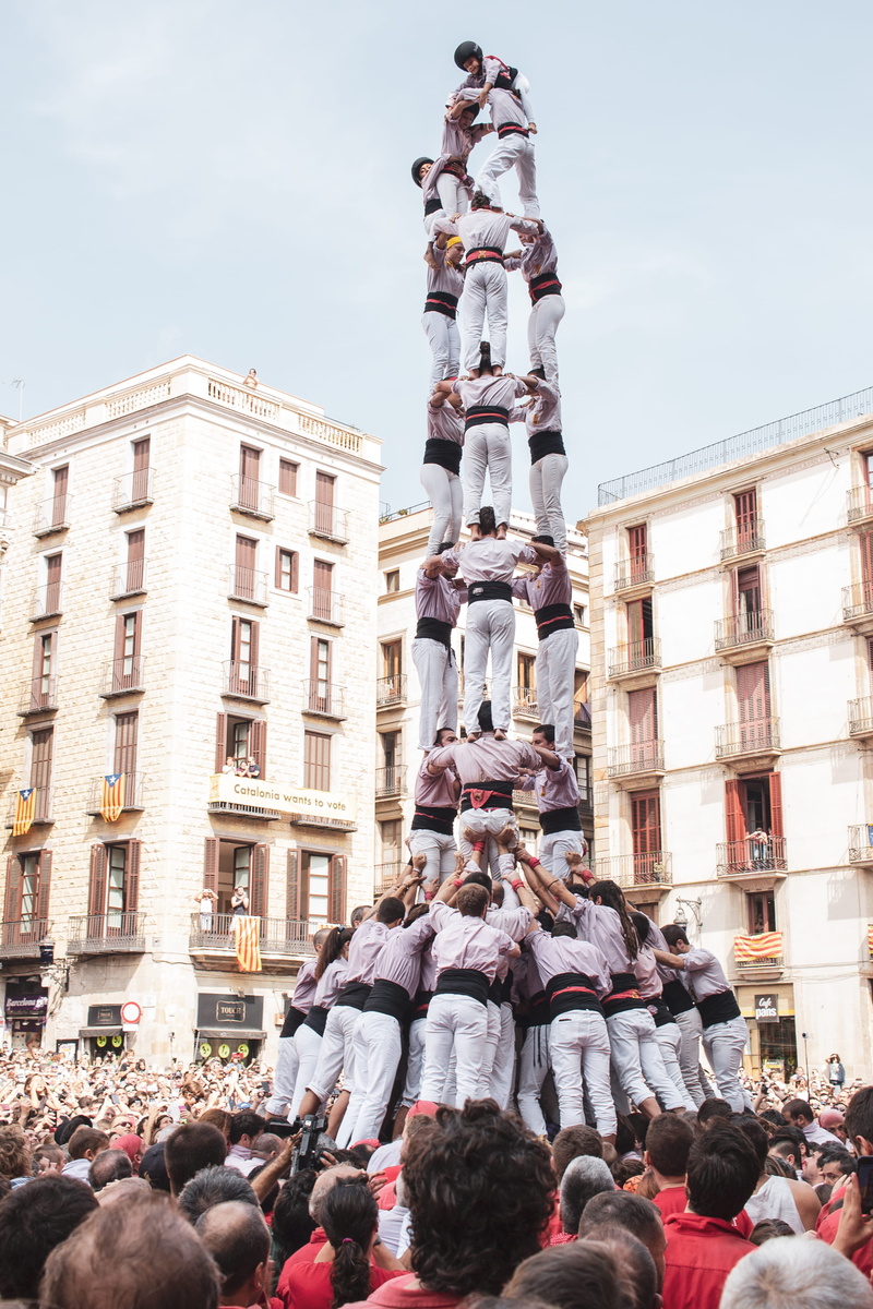 high rise, building, metropolis, city, tower, sculpture, clothing, people, tradition, built structure, leisure activity, real people, crowd, architecture