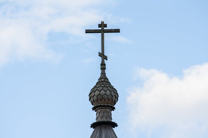 low angle view, church, belief, building, no people, sky, building exterior, outdoors, spire, architecture, nature, cross, spirituality, religion, clouds