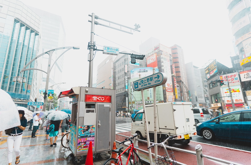 wheel, footwear, incidental people, motor vehicle, car, daytime, building, built structure, japan, apparel, architecture, vehicle, vehicles, nature, machine