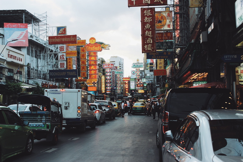 person, building exterior, city street, vehicle, automobile, thailand, street, built structure, script, transportation, wheel, chinatown, motor vehicle