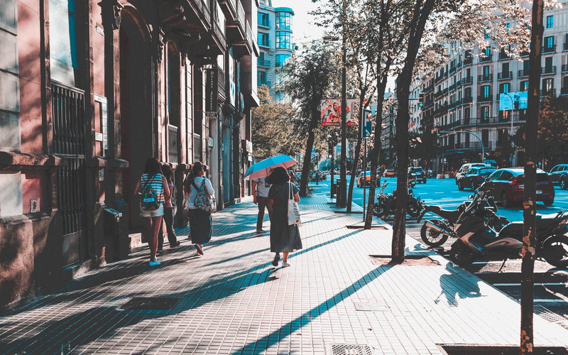 apparel, women, path, woman, bicycle, city life, building exterior, wheel, day, sidewalk, walking, human, outdoors, city street, incidental people, bike