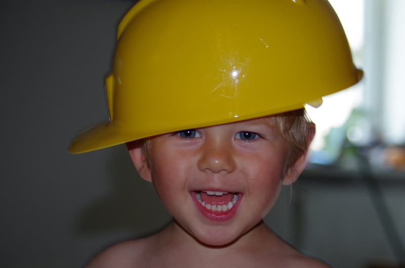 hardhat, care, cheerful, construction workers, looking at camera, men, small child, human face, headwear, smiling, child, work-life balance, headshot, one person