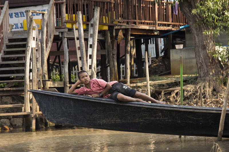 real people, casual clothing, architecture, females, built structure, myanmar (burma), full length, childhood, sitting, one person, inle lake, leisure activity