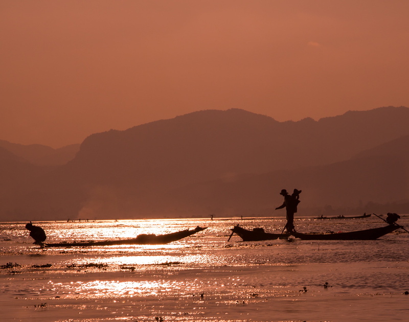 inle lake, occupation, fishing industry, tranquility, one person, mountain, nautical vessel, fisherman, real people, orange color, men, mountain range